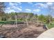 Community playground with swings, climbing structures, and a wood mulch surface at 251 North Crest Dr, Chapel Hill, NC 27517