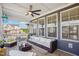 Inviting screened-in porch with cozy wicker furniture, offering a peaceful outdoor living space with neighborhood views at 251 North Crest Dr, Chapel Hill, NC 27517
