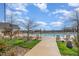 Community pool featuring lounge seating, trees, and manicured landscaping on a sunny day at 251 North Crest Dr, Chapel Hill, NC 27517