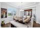 Bright dining room with a stylish table, ample seating, and a beautiful display cabinet at 251 North Crest Dr, Chapel Hill, NC 27517