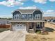 Inviting two-story home boasting a stone-accented garage, covered porch, and well-manicured lawn at 251 North Crest Dr, Chapel Hill, NC 27517
