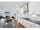Bright kitchen featuring modern marble backsplash and stainless-steel appliances at 251 North Crest Dr, Chapel Hill, NC 27517