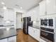 Modern kitchen featuring stainless steel appliances, white cabinets, and marble backsplash at 251 North Crest Dr, Chapel Hill, NC 27517