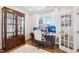 Inviting office space features a large window, hardwood floors, and a beautiful display cabinet at 251 North Crest Dr, Chapel Hill, NC 27517