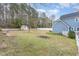 Large backyard features a shed, mature trees, and a well-maintained lawn at 2601 Forestville Rd, Wake Forest, NC 27587