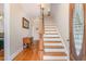 Entryway with hardwood floors and a staircase at 2601 Forestville Rd, Wake Forest, NC 27587