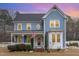 Charming two-story home features a welcoming front porch and manicured landscaping at 2601 Forestville Rd, Wake Forest, NC 27587