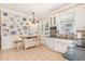 Eat-in kitchen with white cabinets, tiled floors, granite countertops, and stainless steel appliances at 2601 Forestville Rd, Wake Forest, NC 27587