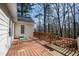 Spacious back deck made of wood, features a wooden railing with flower boxes overlooking the trees at 2776 Jordan Ct, Creedmoor, NC 27522