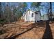 A charming home with a wooden deck nestled in a wooded area, offering privacy and a serene outdoor space at 2776 Jordan Ct, Creedmoor, NC 27522