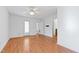 Large bedroom with hardwood floors, ceiling fan, a glass patio door, and access to other rooms at 2776 Jordan Ct, Creedmoor, NC 27522