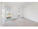 Sunlit bedroom with carpeted floor and two large windows providing ample natural light and exterior view at 2776 Jordan Ct, Creedmoor, NC 27522