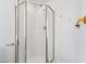 Modern shower with glass doors and white tile, complemented by fixtures and a minimalist design at 2776 Jordan Ct, Creedmoor, NC 27522