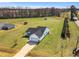 Beautiful, well-kept home with spacious lawn and tree line in the background at 28 Sandcastle Ln, Four Oaks, NC 27524
