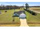 A beautiful single-story home with mature landscaping and a long driveway at 28 Sandcastle Ln, Four Oaks, NC 27524