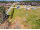 A sprawling property features mature trees surrounding this home with lots of land and privacy at 28 Sandcastle Ln, Four Oaks, NC 27524