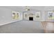 Bright living room features a fireplace, ceiling fan, and abundant natural light at 28 Sandcastle Ln, Four Oaks, NC 27524