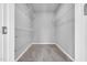 Spacious walk-in closet with carpet and ample shelving to organize your wardrobe at 28 Sandcastle Ln, Four Oaks, NC 27524