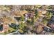 An aerial view of a home in a neighborhood featuring mature trees and a winding driveway leading to the front of the house at 3001 Blanche Dr, Burlington, NC 27215