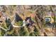 Aerial view showcasing the property, surrounding trees, and pool area at 3001 Blanche Dr, Burlington, NC 27215