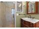 Bathroom showcasing a vanity with a sink and shower at 3001 Blanche Dr, Burlington, NC 27215