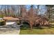 Charming brick home featuring an attached two-car garage and a well-manicured lawn at 3001 Blanche Dr, Burlington, NC 27215