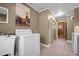 Clean laundry room featuring tile floors, a laundry sink, and appliances at 3001 Blanche Dr, Burlington, NC 27215