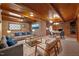 Spacious living room with wood paneled ceiling, brick walls, and a cozy fireplace at 3001 Blanche Dr, Burlington, NC 27215