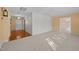 Spacious living room featuring carpet flooring, yellow walls, and ample natural light at 3001 Blanche Dr, Burlington, NC 27215