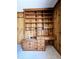 Close-up of a built-in wooden desk with shelving, drawers, and wooden paneling at 3015 Nc Hwy 87 South, Graham, NC 27253