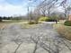 Circular driveway leading to the property with mature landscaping and a traditional mailbox at 3015 Nc Hwy 87 South, Graham, NC 27253
