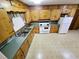 Well-lit kitchen with ample wooden cabinets, a classic oven, and a bright ambiance at 3015 Nc Hwy 87 South, Graham, NC 27253