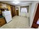 Bright kitchen space with vintage cabinets and vinyl floor at 3015 Nc Hwy 87 South, Graham, NC 27253