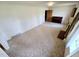 Bright living room with carpet, fireplace and upright piano at 3015 Nc Hwy 87 South, Graham, NC 27253