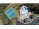 Aerial of community pool and tennis courts with parking at 307 Kellyridge Dr, Apex, NC 27502