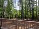 Wooded backyard with mature trees and private wooded fence at 307 Kellyridge Dr, Apex, NC 27502