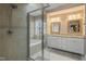 Bright bathroom featuring a shower, soaking tub, and double vanity with granite countertops at 307 Kellyridge Dr, Apex, NC 27502