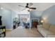 Bedroom with neutral carpet, sofa, desk, bookcase, ceiling fan and sloped ceiling at 307 Kellyridge Dr, Apex, NC 27502
