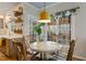 Inviting breakfast nook features a bright window and a stylish pendant light at 307 Kellyridge Dr, Apex, NC 27502
