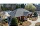 Inviting one-story brick home near community pool featuring manicured landscaping and a welcoming entrance at 307 Kellyridge Dr, Apex, NC 27502