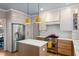 Modern kitchen featuring stainless steel appliances, a center island, and white subway tile backsplash at 307 Kellyridge Dr, Apex, NC 27502