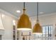 Modern kitchen lighting featuring pendant lights, white subway tile, and a view to the outside at 307 Kellyridge Dr, Apex, NC 27502