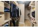Well-organized walk-in closet with shelving, drawers, and ample hanging space at 307 Kellyridge Dr, Apex, NC 27502