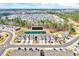 Expansive aerial view of a residential community with a pond and well-maintained landscaping at 3162 Retama Run # 231, Apex, NC 27562