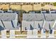 Aerial view of townhomes with manicured lawns and parking spaces, offering a convenient lifestyle at 3162 Retama Run # 231, Apex, NC 27562