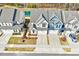 Aerial view of homes featuring well-maintained lawns, driveways, and community landscaping at 3162 Retama Run # 231, Apex, NC 27562