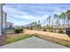 Large, unfenced backyard offers a patio area and ample space for outdoor activities and landscaping at 3162 Retama Run # 231, Apex, NC 27562