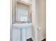 Bathroom featuring a pedestal sink, a framed mirror, and modern fixtures at 3162 Retama Run # 231, Apex, NC 27562