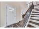 Welcoming entryway with staircase and wood-look flooring at 3162 Retama Run # 231, Apex, NC 27562