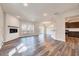 Bright, open living area featuring a fireplace and access to the kitchen at 3162 Retama Run # 231, Apex, NC 27562